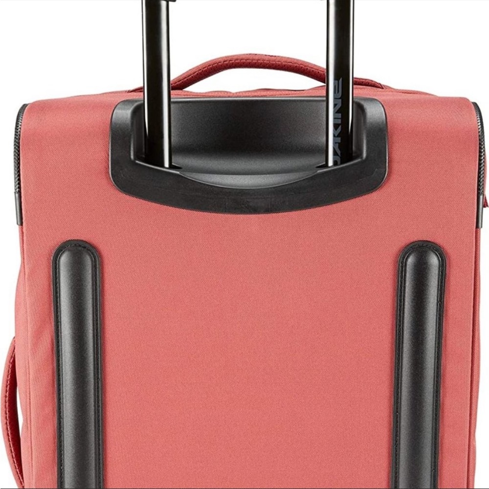 DaKine carry on roller bag. Dark Rose.